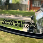 Objects in Mirror Appear to be Losing Car Sticker