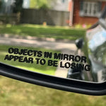 Objects in Mirror Appear to be Losing Car Sticker