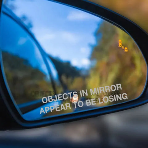 Objects in Mirror Appear to be Losing Car Sticker