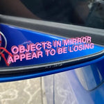 Objects in Mirror Appear to be Losing Car Sticker